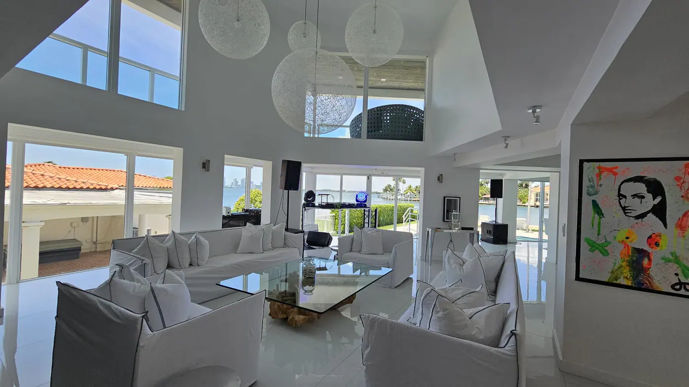 Pristine luxury living room with waterfront views after housekeeping